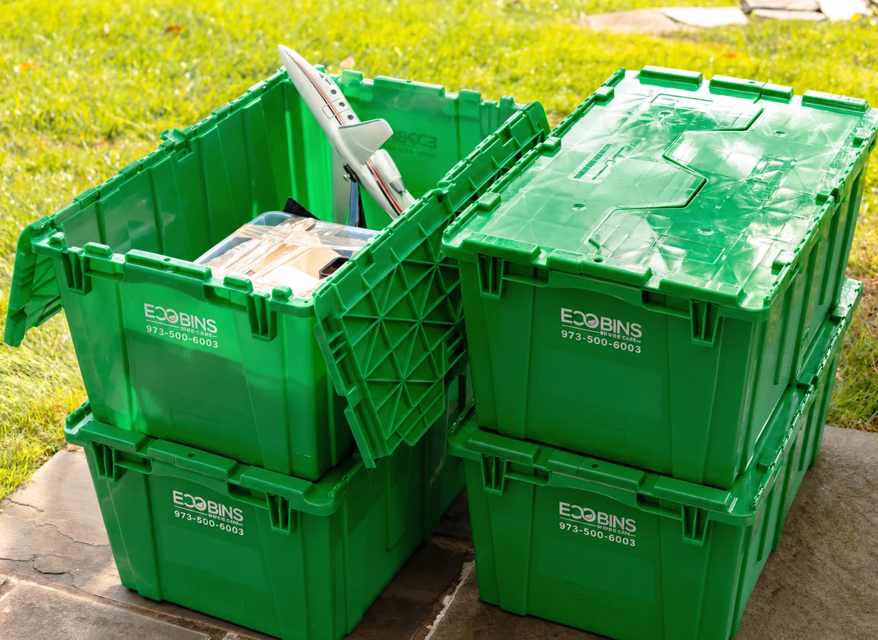 An open EcoBin beside closed bins, showing the split interlocking lids and reinforced sides